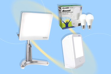Miracle Boost LED Wake Up Light, Cares Day Light Lamp, and Verilux Compact Lamp on a light blue background