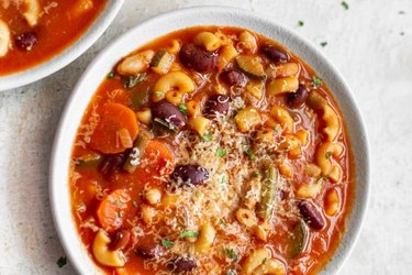 Instant Pot Minestrone Soup in a white bowl on gray countertop.
