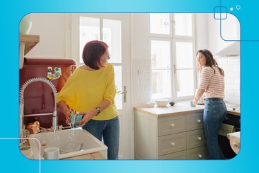 An aging parent and her daughter having a conversation while working together in the kitchen