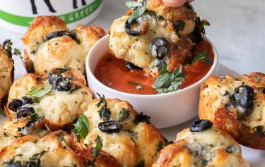 High Protein Muffin Tin Dinner Pizza Bites with a red dipping sauce