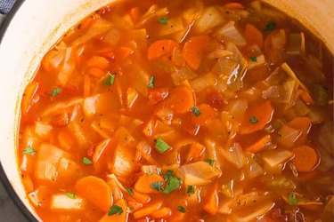 Close up of cabbage soup in a slow cooker pot