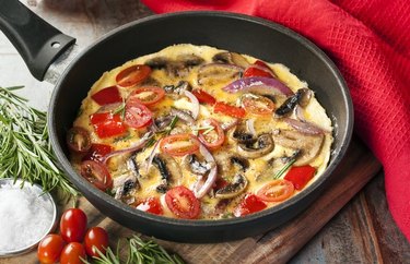 Sunflower garden omelette in a pan with a red cloth napkin