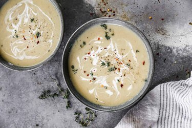 an overhead photo of two cups of Potato Leek Soup.