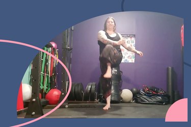 Person does the marching X stretch for mobility on a yoga mat in a home gym