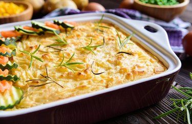 High Protein Breakfast Casserole Not Your Average Shepherd's Pie in a metal casserole dish with parsley sprigs