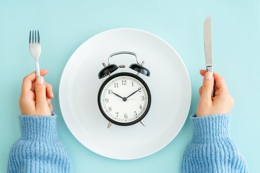 an empty plate with a clock