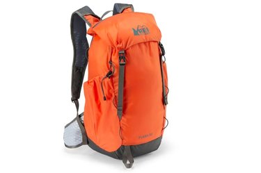 the REI Flash Pack, shown in bright orange, is the best budget hiking backpack