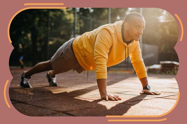 Man doing a burpee in the park outdoors