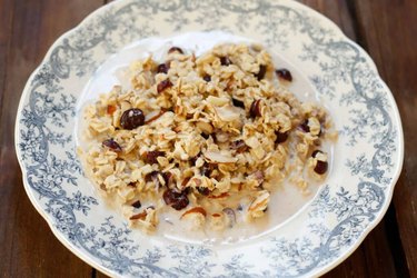 Slow cooker cranberry almond oatmeal in a blue and white dish