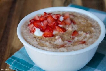 Crock-Pot strawberries and cream oatmeal in a white bowl
