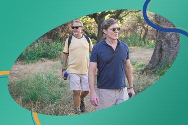 couple in sunglasses hiking outside to take more steps for the daily steps challenge