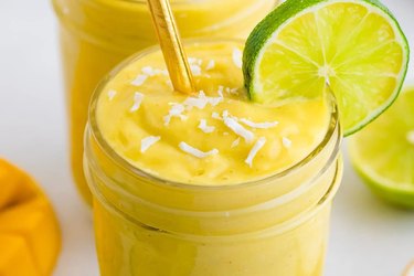 mango avocado smoothie recipe in mason jar with lime