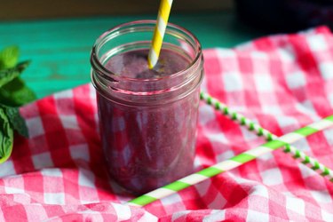 avocado smoothie recipe with grape juice in a jar with a straw