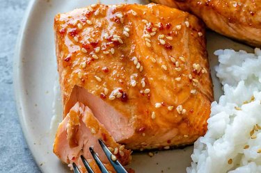Honey glazed air fryer salmon recipe with sesame seeds and a side of white rice