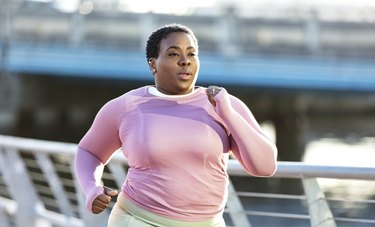 Person with overweight running outside