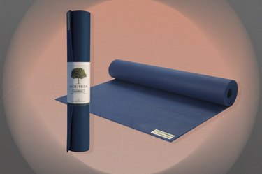 navy blue jade harmony professional yoga mat on a pink and black background