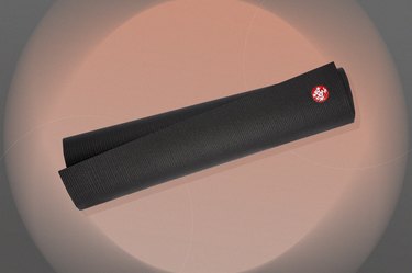 black manduka pro yoga mat 6mm on a pink and black background