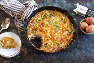 Cauliflower Breakfast Skillet Casserole with a white plate and a bowl of brown eggs