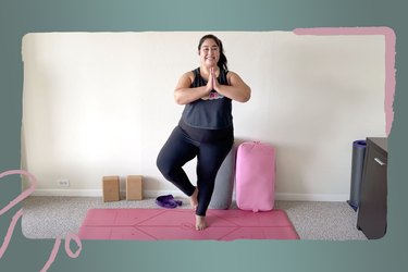 Woman in black doing tree pose on a pink yoga mat during yoga challenge