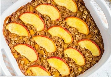 Peach Baked Oatmeal in a white baking dish