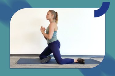 Person performing the shin box get-up exercise for lower-body strength and mobility.