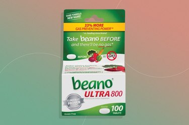 Beano, one of the best digestive enzyme supplements, on a green and pink background