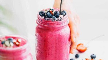 mason jar filled with berry white bean smoothie, a delicious breakfast for brain health