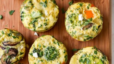 closeup of Baked Egg Muffins on a wooden cutting board