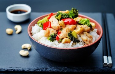 10-Minute Stir-Fry in a black bowl with cashews and black chopsticks