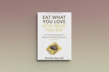 Eat What You Love, Love What You Eat by Michelle May, against a gray background