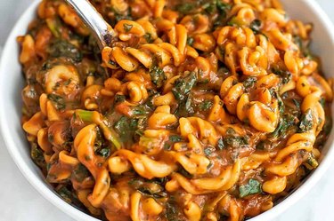 Instant Pot with chickpea pasta with greens in tomato sauce