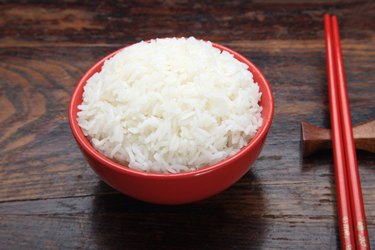 Close-up of a bowl of rice with chopsticks