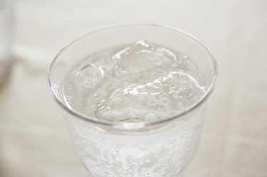 Glass of soda on table, close up