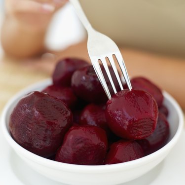 Close-up of a fork in a bowl of beetroot
