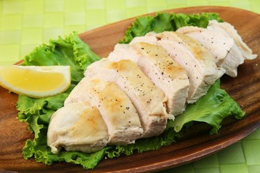 A sliced chicken breast on a plate.