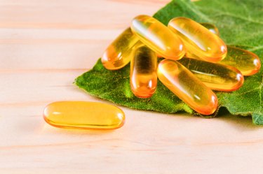 Vitamin D spilled contents on wooden table