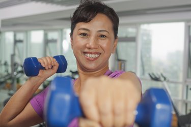 Woman exercising with weights