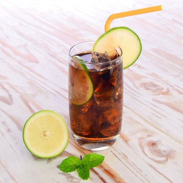 Cool Cola Drink With Lemon and Ice cube