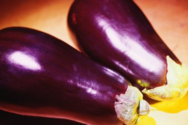 Two whole eggplants