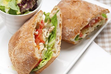 ciabatta panini sandwich with chicken and tomato