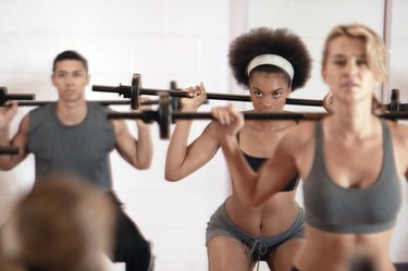 Exercise class with barbells