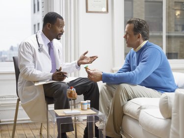 Doctor Discussing Medicine in His Clinic With a Patient