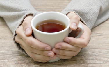 white mug in hands