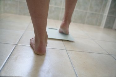 Man's feet on a weighing scale