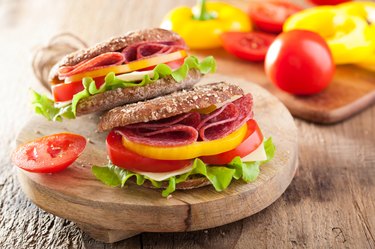 healthy sandwich with salami tomato pepper and lettuce