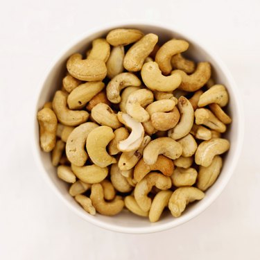 Elevated view of a bowl of salted cashew nuts
