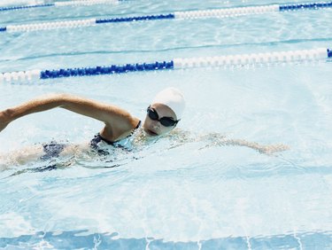 Young Woman Swimming in a Pool