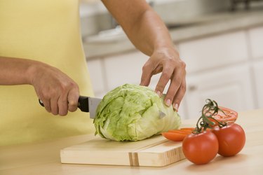 Woman cutting lettuce
