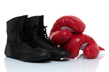 Boxing gloves and shoes isolated on white