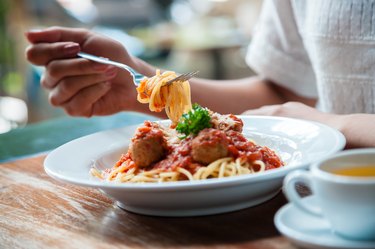 woman eating spaghetti